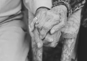 Walter and Evelyn close up of hands being held
